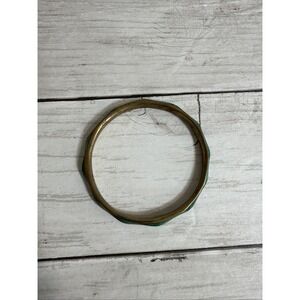 Vintage brass bangle bracelet with turquoise-colored inlay.